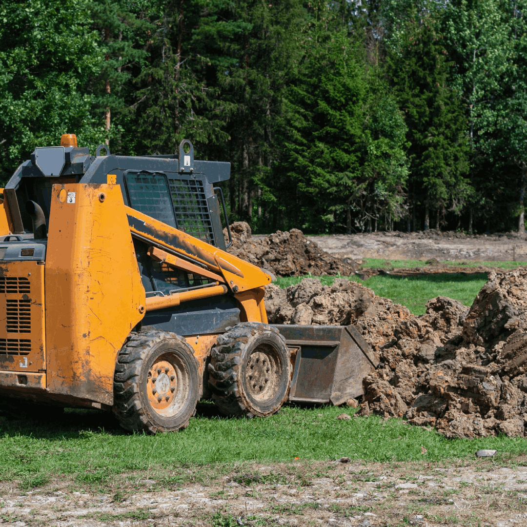 excavator working on the construction site of a new residential building excavator working on the construction site of a new residential building<br />